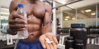 fitness guy with fat burning pills