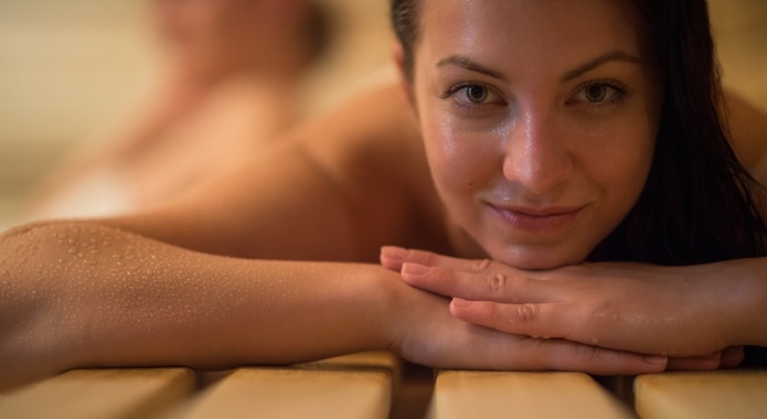 woman sweating in sauna