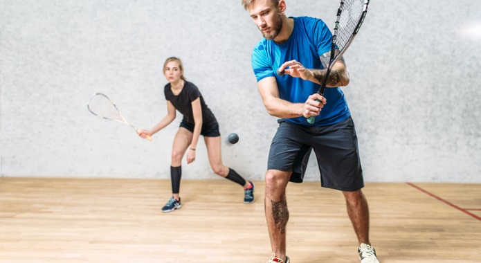 couple playing squash